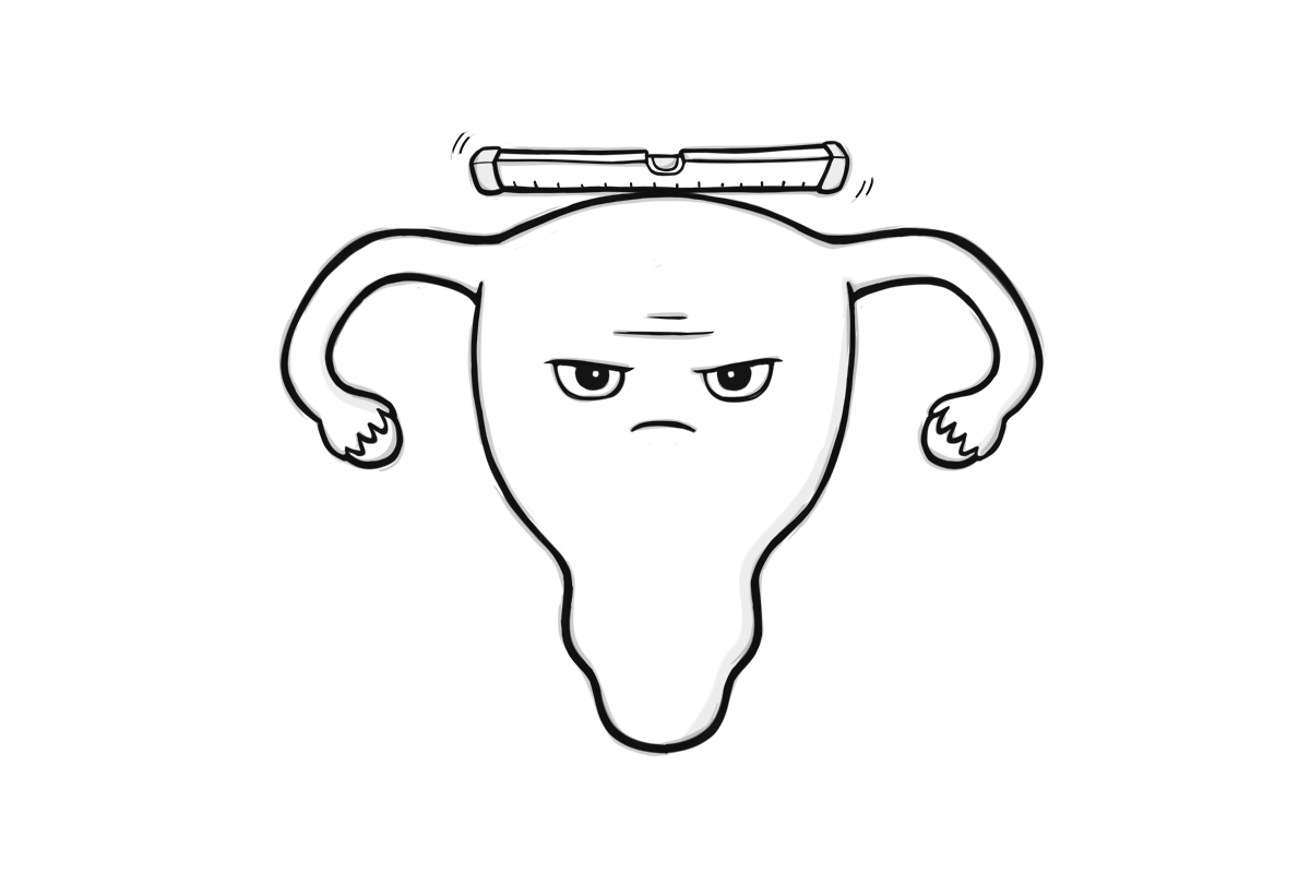 Spirit level balancing on top of a uterus
